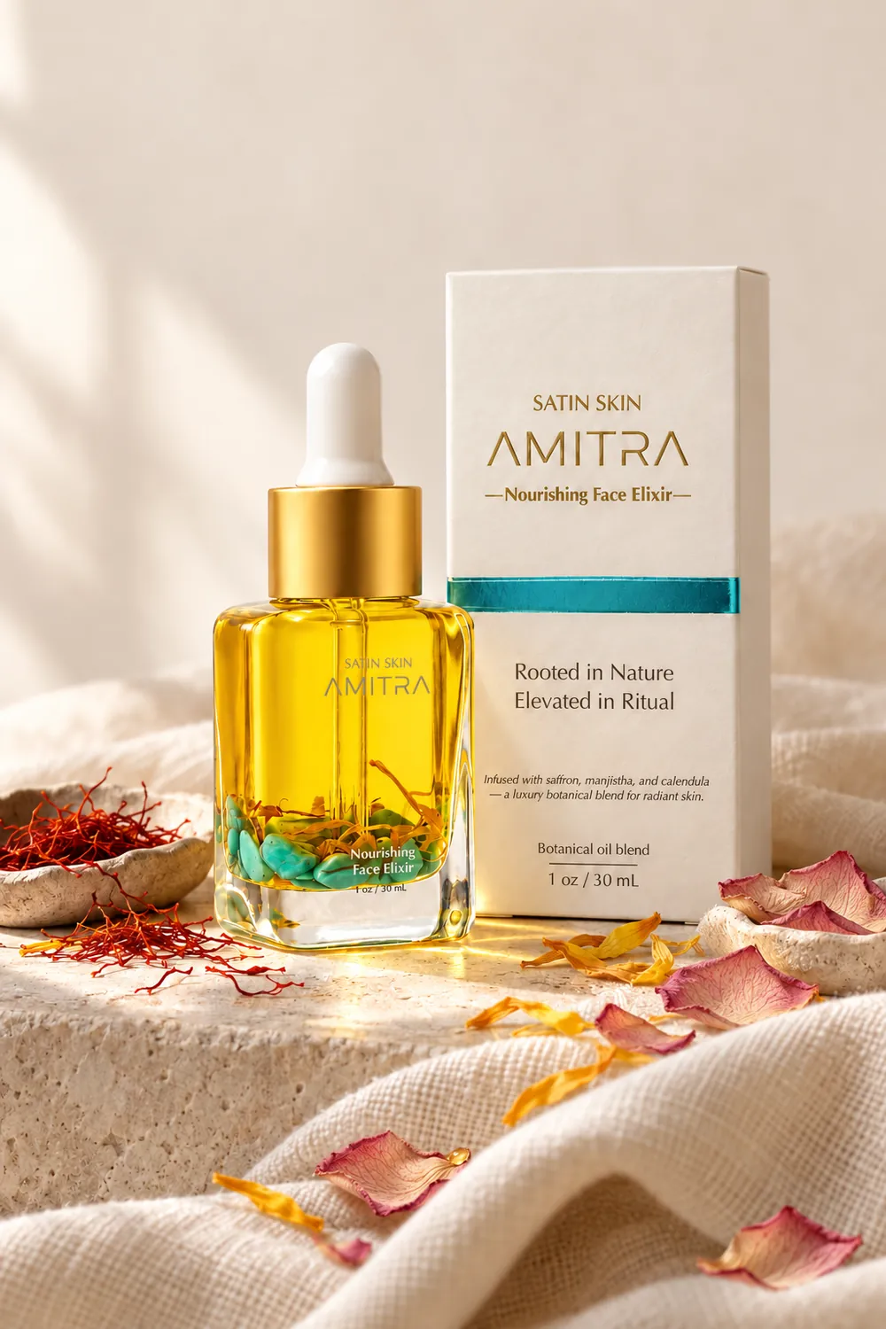 Amitra Satin Skin face oil and its ivory box with saffron threads, calendula and rose petals on linen