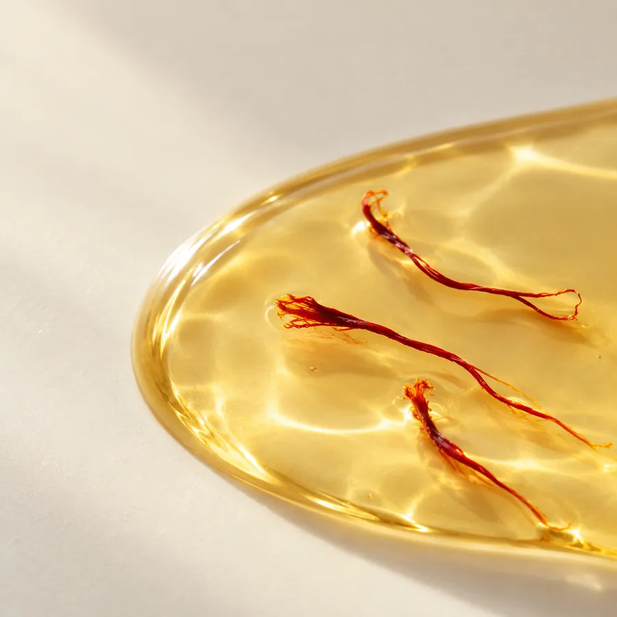 Saffron threads suspended in golden oil